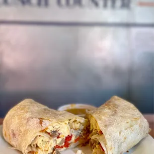 Build Your Own Breakfast Burrito Peppers, onions, sausage, cheddar cheese. Nom!