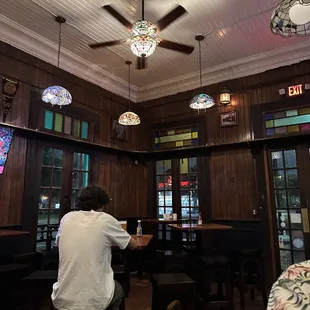 a man sitting at a table in a restaurant