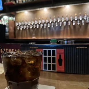a glass of soda on a table