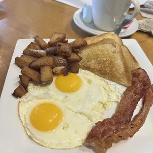 Lucky Two w/ sunny side up eggs, bacon strips, biscuits?!?! and potatoes $9.95 my picture looks better than it tastes.