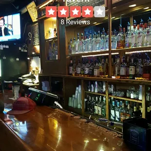a bar with bottles of liquor