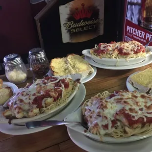 Chicken Parmesan baked on Spaghetti with garlic bread and a side salad $6.95 all day every Thursday: dine in only