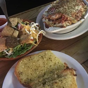 Chicken Parmesan baked on spaghetti with garlic bread &amp; side salad