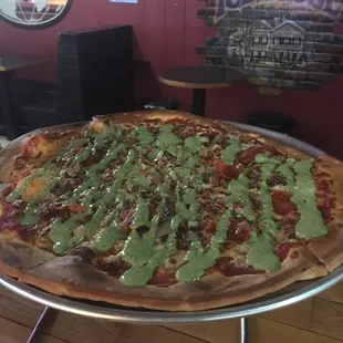October Pizza of the Month; Pesto-palooza! traditional tomato base Bacon  Mushrooms  Pepperoni &amp; mozzarella w/Pesto drizzle