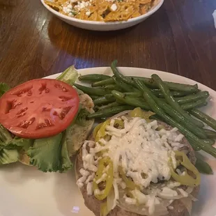 Pasta with faux chicken; Impossible burger with gluten free bun and green beans (before the bun was touched)
