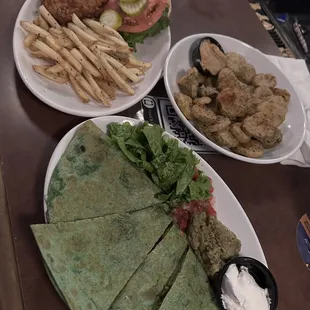 vegan Quesadilla with soyrizo and vegan fried chicken sandwich! and Fried Pickles that are also vegan