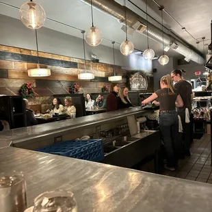 a busy restaurant with customers