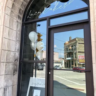 the reflection of a street light in a window