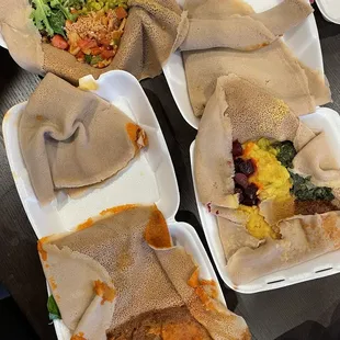 Awaze Beef Tibs (Mild or Spicy) on the bottom, Vegan Sampler Platter on top