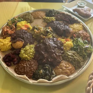 "Vegan sampler platter for 3-4 people,  meat combo and beef samosa.