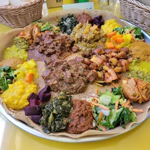 Vegan sampler, in-n-out tibs, fish curry, chicken tibs, awaze beef and awaze lamb (mild)