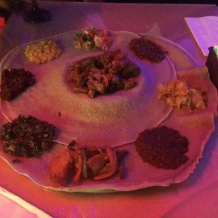 Late night (hence lighting) awaze tibs and vegetarian platter.