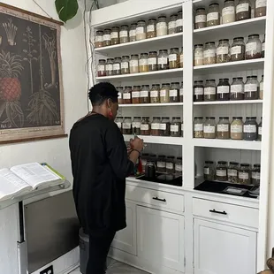 Maria mixing herbs for tea