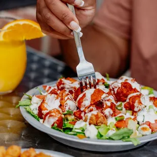  a woman eating a salad