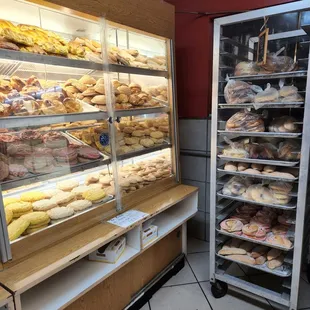 a display case with a variety of donuts