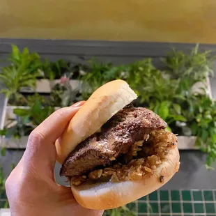 Juicy Lucy outside with cooked onions