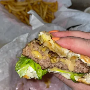 Juicy Lucy with grilled onions, add lettuce.