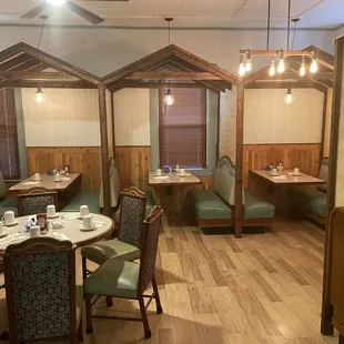 a dining area with booths and tables