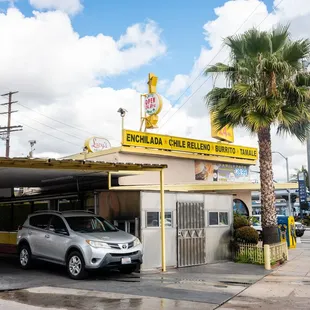a car parked in front of the drive - in