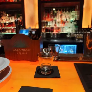 a glass of water on the bar