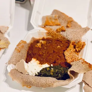 Beef tibs wot. YUM!!! With cottage cheese and greens. The perfect bite has all 3.