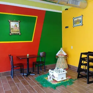 a table and chairs in a brightly colored room