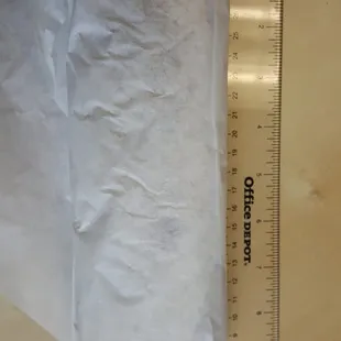 It's a fair 9" burrito.. not that small as some people reviewed it to be.