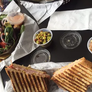 Ham and cheese panini, garden salad with champagne dressing, sides of Texas caviar and edamame salad