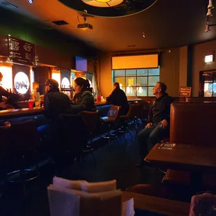 people sitting at a bar