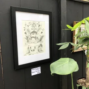 Patio featuring &quot;Dope Art Show&quot; with local artists and plants