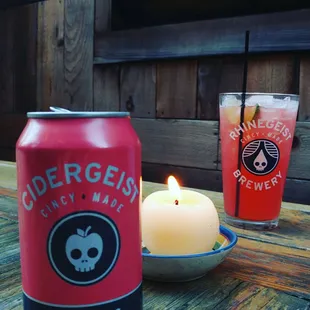 a can and a candle on a table