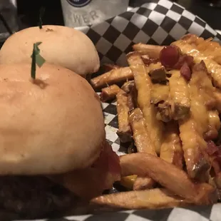 Burgers and fries with cheese and bacon