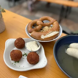 Spaetzle cheese croquettes, pretzel, sauerkraut, weisswurst