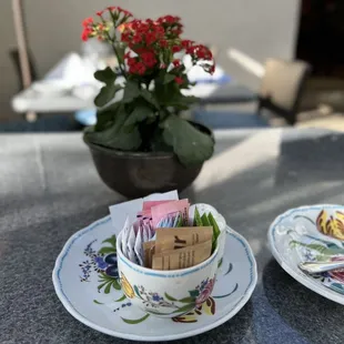 a table with plates and cups of food