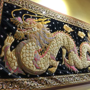 Gorgeous hand-crafted beaded dragon adorns the wall and makes you feel like you're in Thailand