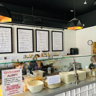 a counter with bowls of food
