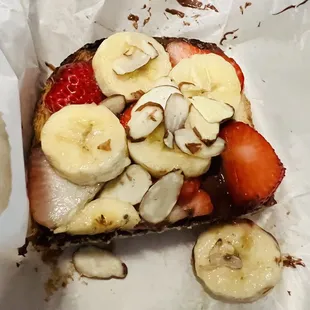 a piece of toast with fruit on it
