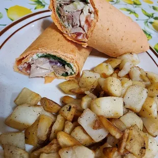 a burrito and potatoes