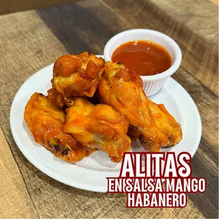 Delicious fried chicken wings sautéed in mango habanero sauce.