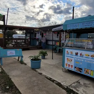a food stand and a sidewalk
