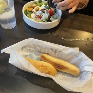 Bread sticks and salad.
