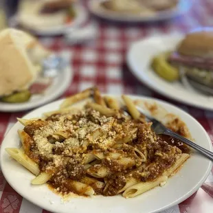 a plate of pasta with meat and cheese