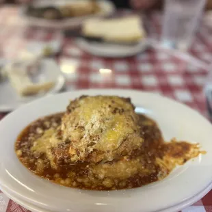 a plate of lasagna on a table