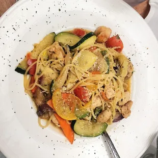 Chicken Capellini; Chicken in olive oil and garlic, mixed squash, carrots, artichoke, white wine sauce, over spaghetti