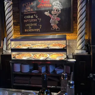 pizzas being prepared