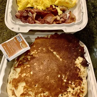 Kid&apos;s pancakes with scrambled eggs and bacon. These pancakes are huge!