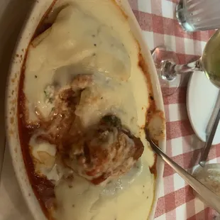 a dish of meatballs and cheese