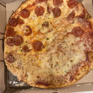 Half pepperoni, half cheese pizza