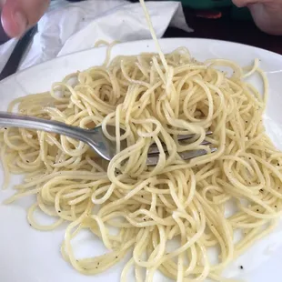 Kid's spaghetti with butter and cheese.