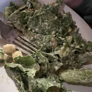 Caesar salad half eaten.